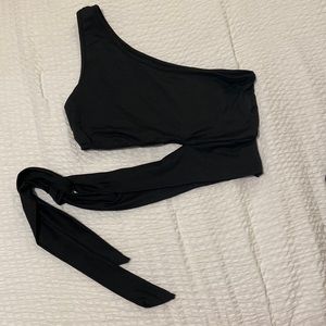 Black one shoulder crop top with side tie at the bottom